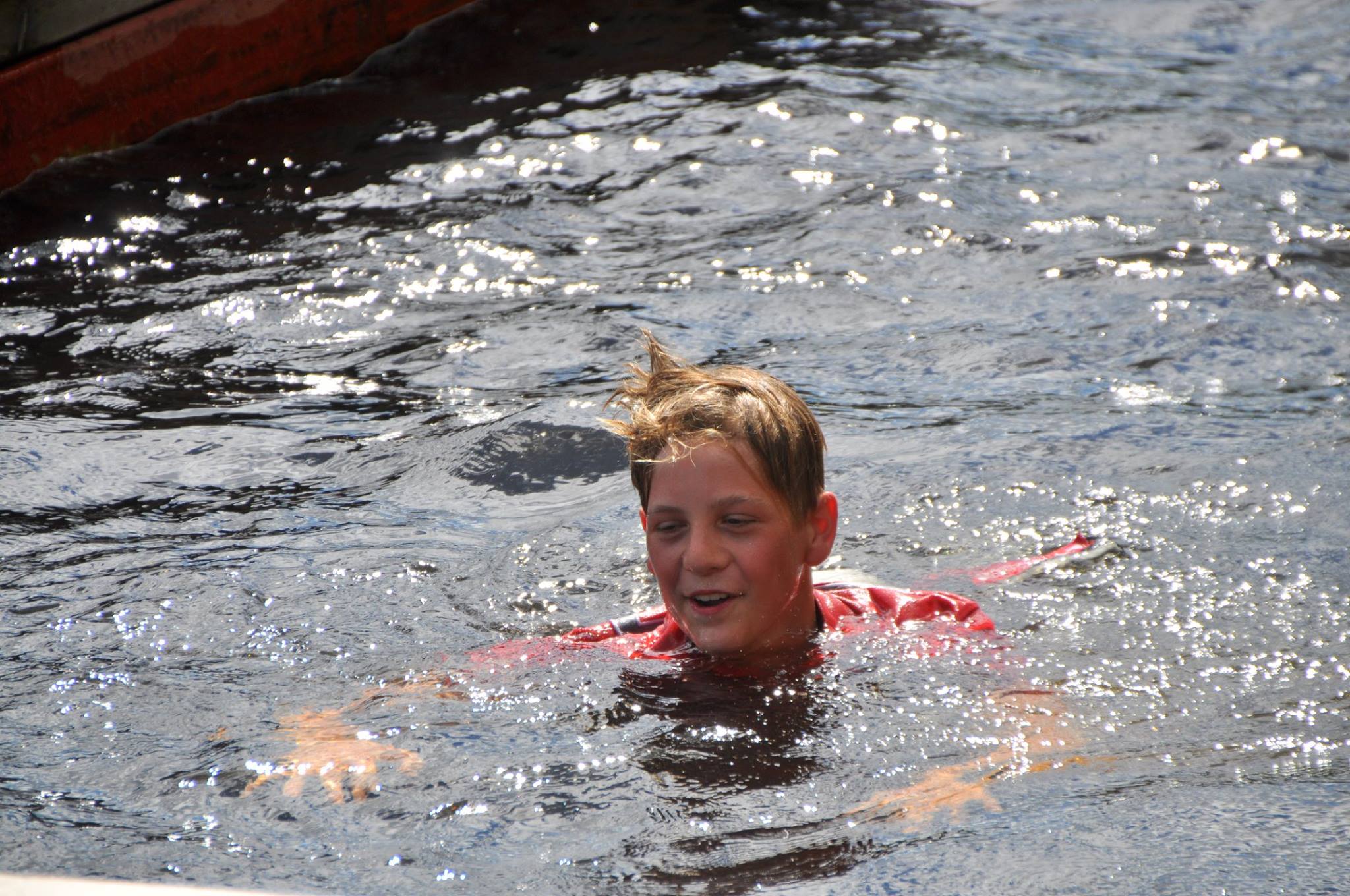 Marius Strand celebrates his first podium with a swim